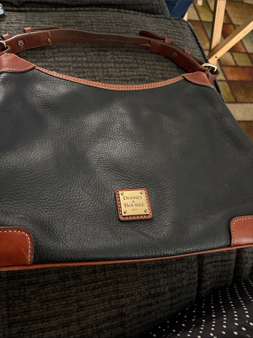 Dooney & Bourke Black Leather Messenger Bag with Brown Trim